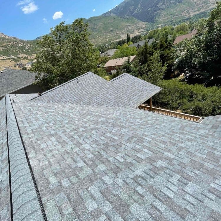 Completed shingle roof with Utah mountain backdrop
